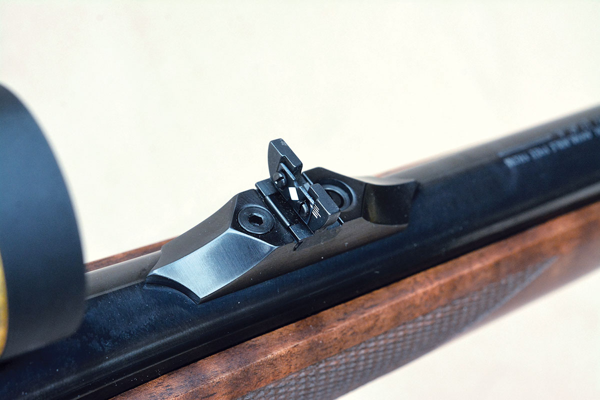 The rear sight is folding and adjustable.